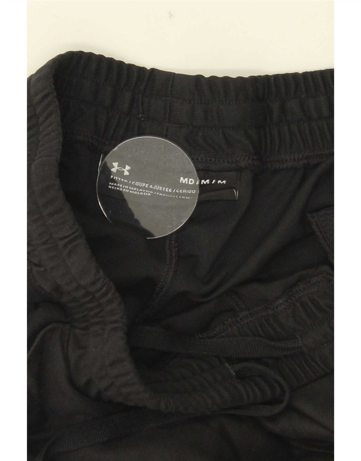 Under Armour Pantalón de chándal ajustado en color negro mediano