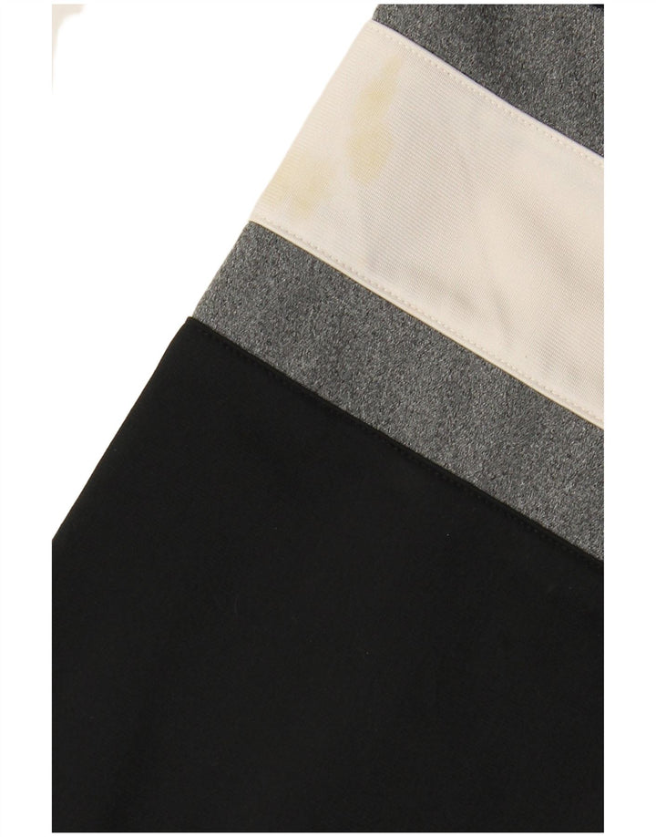 REEBOK Chaqueta superior de chándal con gráfico de corte holgado para hombre Small Black Colourblock