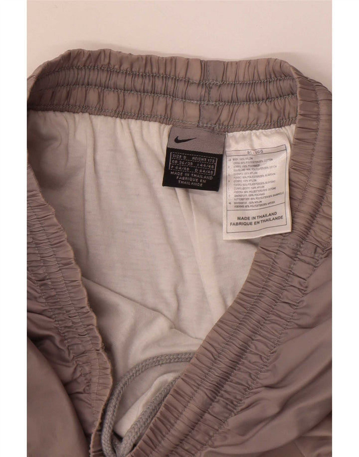 Nike - Pantalón de chándal para hombre, talla pequeña, nailon gris