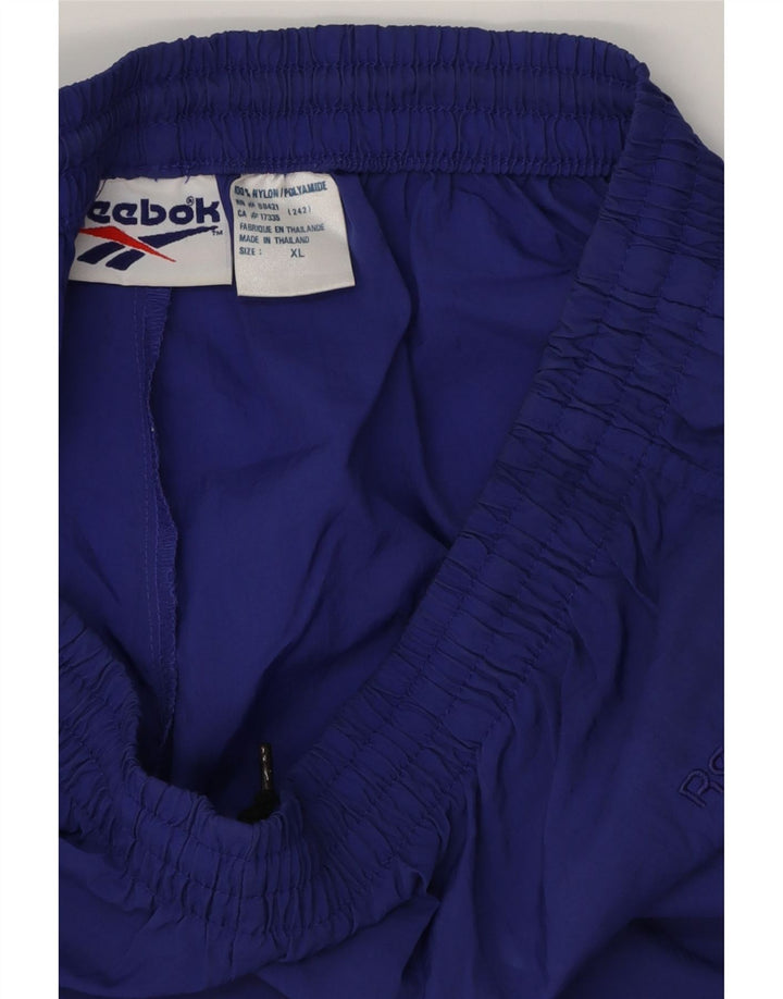 REEBOK Pantalón de Chándal Hombre Joggers XL Poliéster Morado