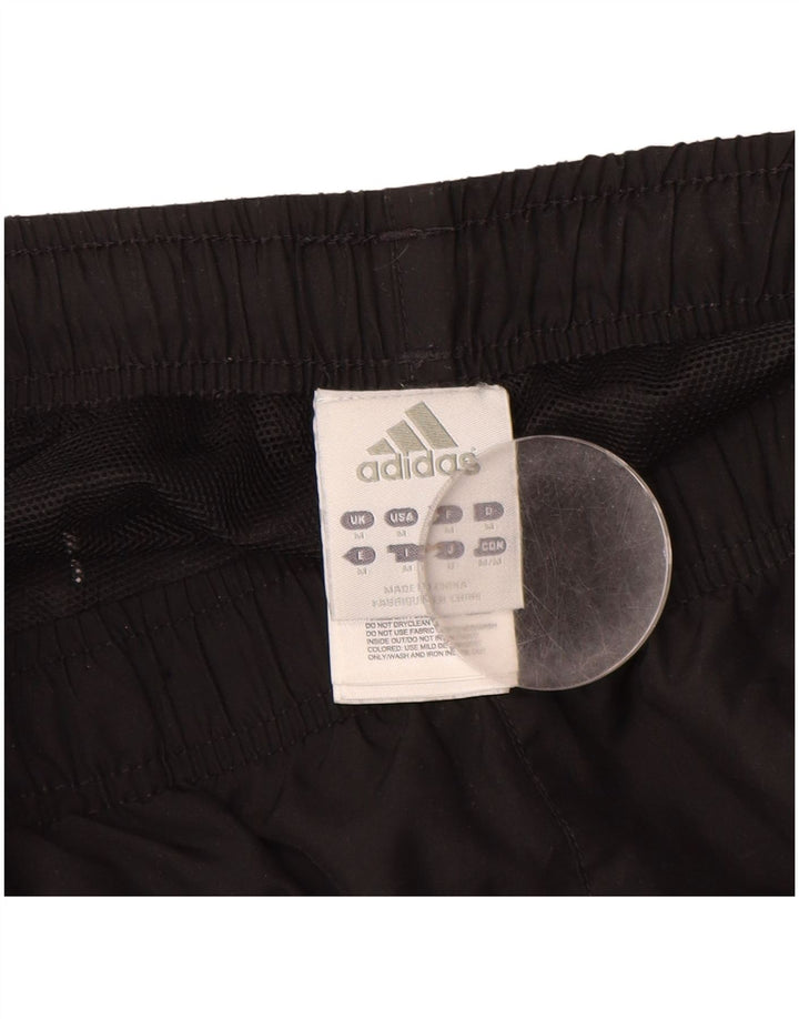 ADIDAS Pantalón de chándal gráfico para hombre Poliéster negro mediano