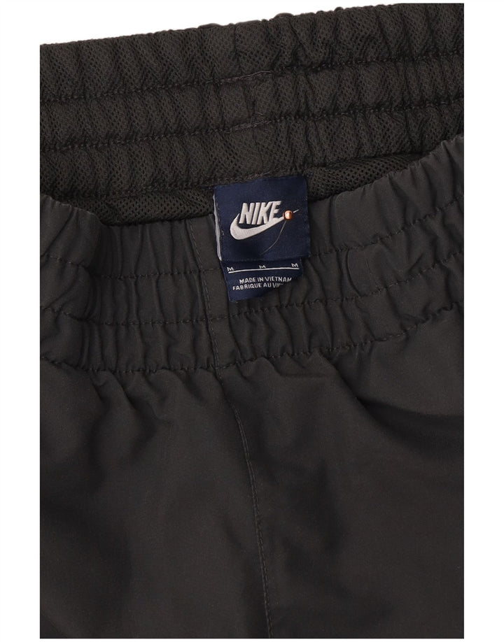 NIKE Hombre Pantalones de Chándal Joggers Gris Medio Poliéster