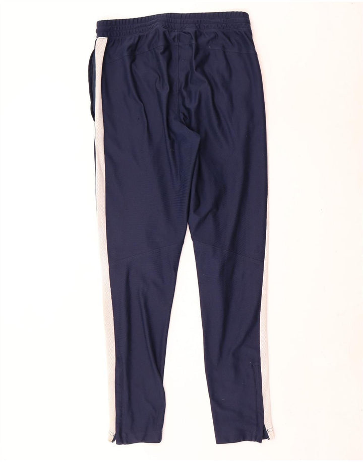 Under Armour Hombre Pantalones de chándal ajustados color block en azul marino mediano