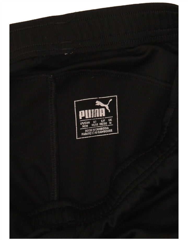 Puma - Pantalón cortavientos para mujer, talla 40, talla M, color negro