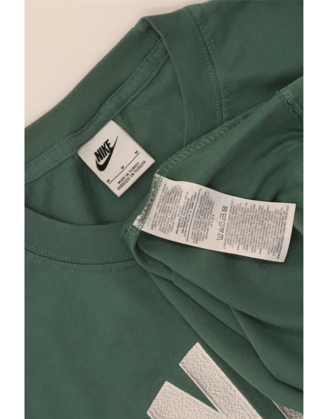 Nike Camiseta gráfica para hombre Top verde medio de algodón con bloques de color