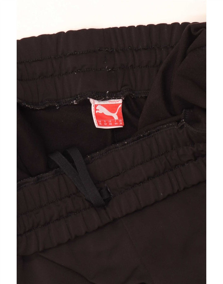 Puma - Pantalones de chándal para mujer, talla 40, color negro
