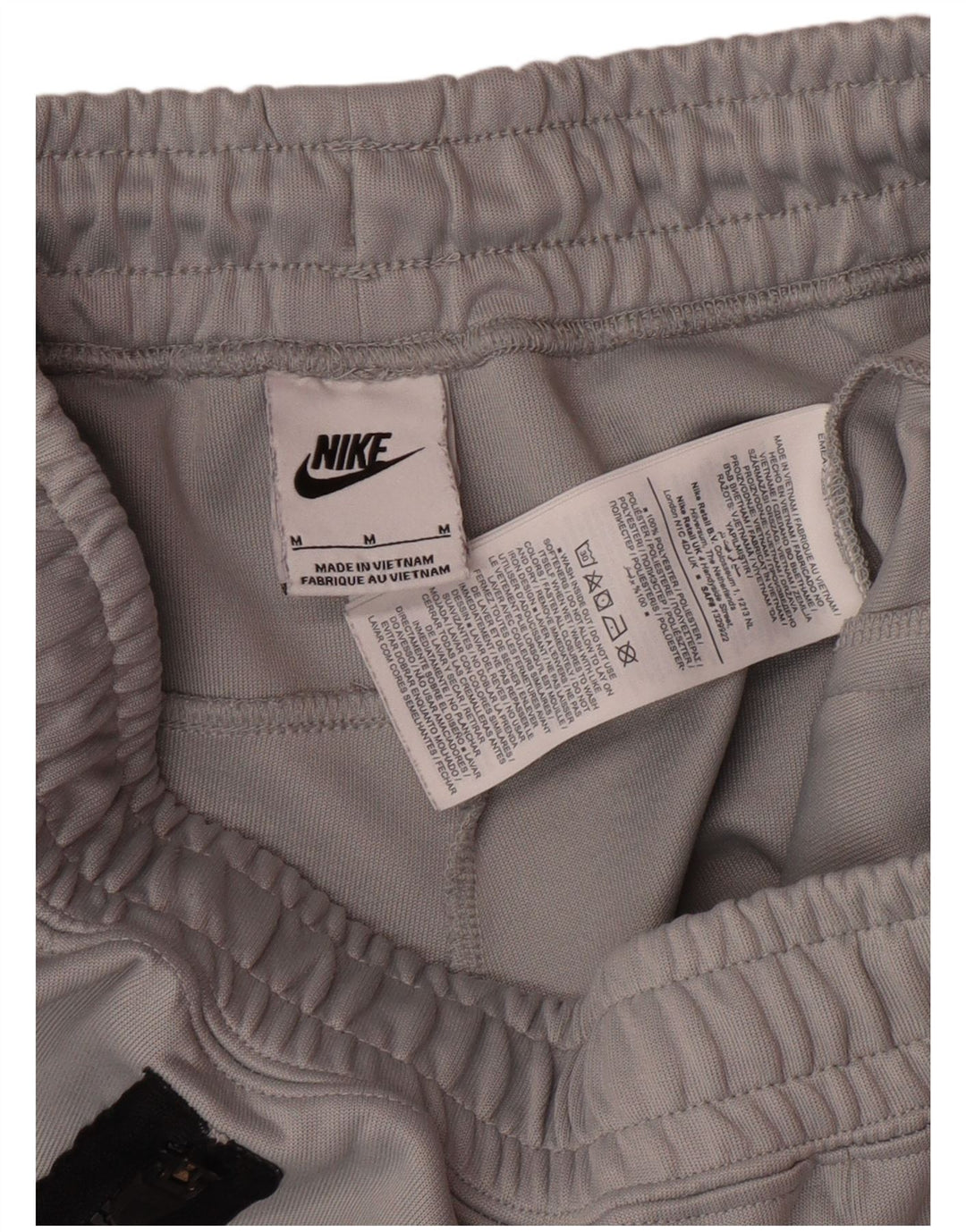 NIKE Hombre Pantalones de Chándal Joggers Gris Medio Poliéster