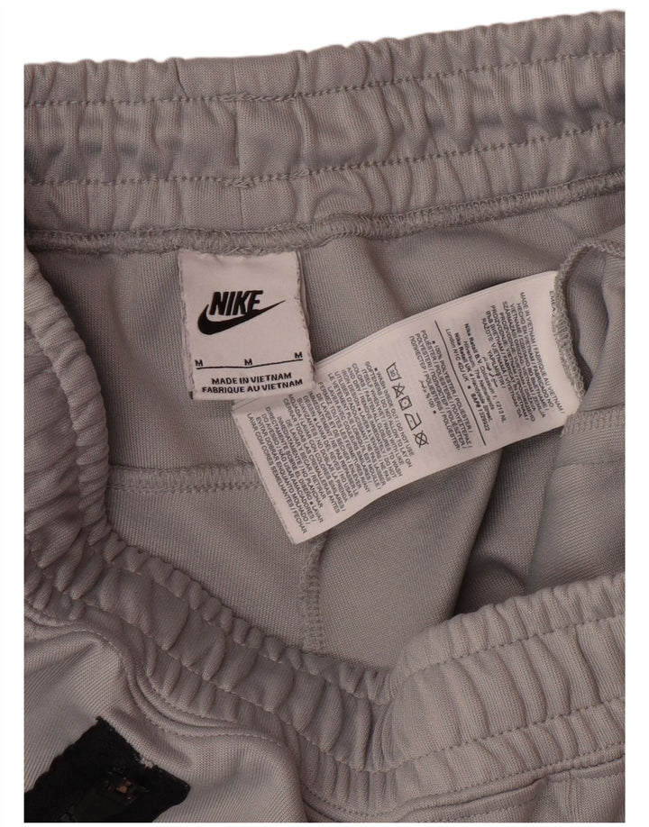 NIKE Hombre Pantalones de Chándal Joggers Gris Medio Poliéster