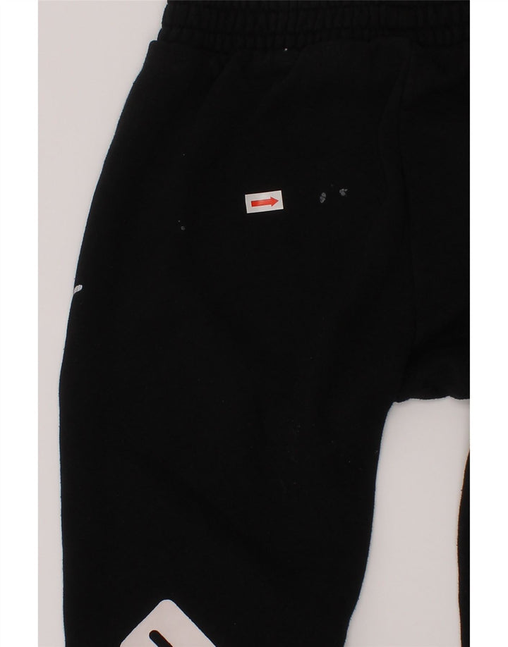 Puma Pantalones de chándal con estampado gráfico para niños 4-5 años Algodón negro