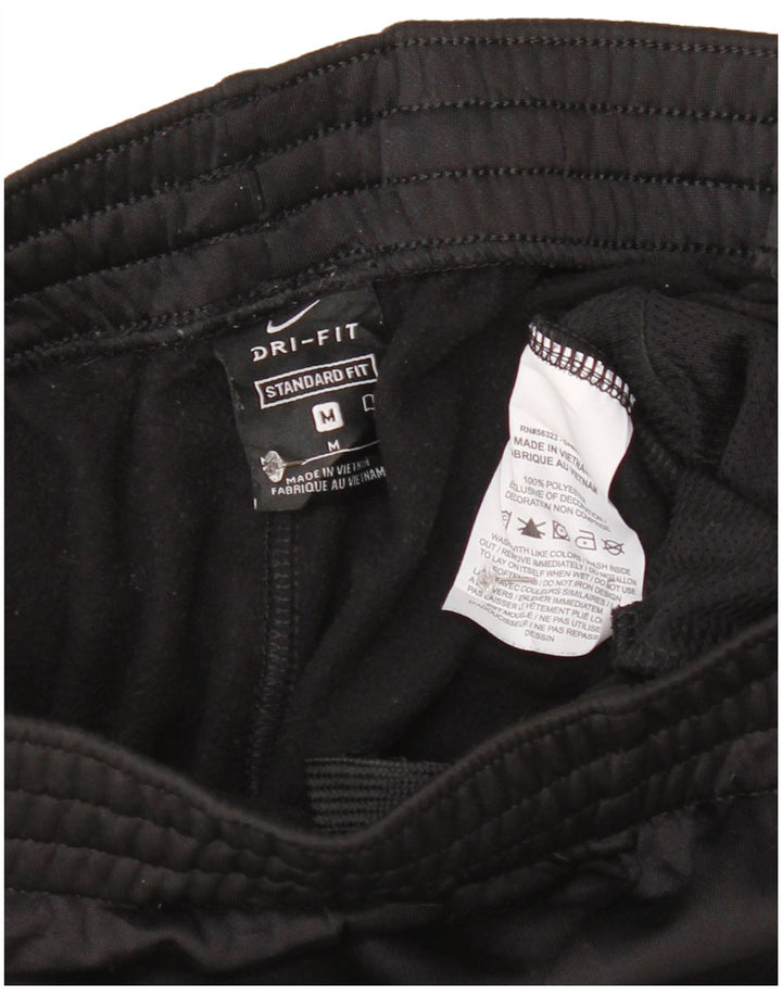 Nike Pantalones de chándal con gráfico para niños, 10-11 años, mediano, negro