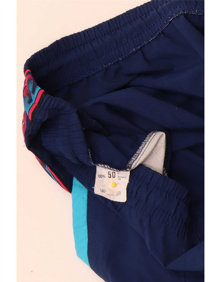 Asics Hombre Pantalones De Chándal Gráfico IT 50 Medium Azul Marino Colorblock
