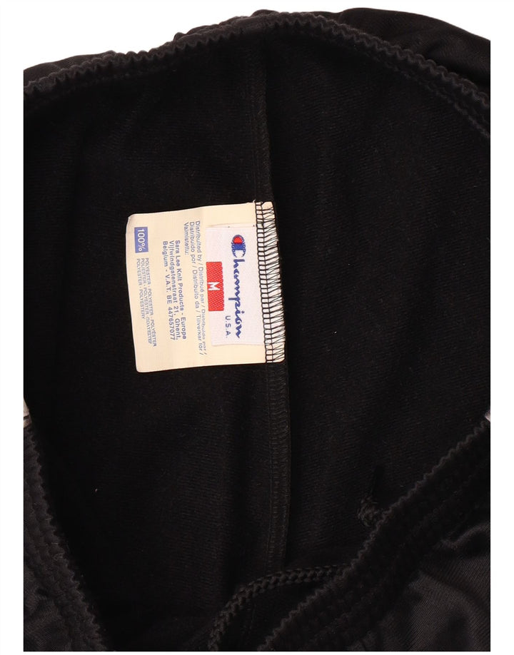 CHAMPION Pantalones de chándal con estampado gráfico para hombre Poliéster negro mediano