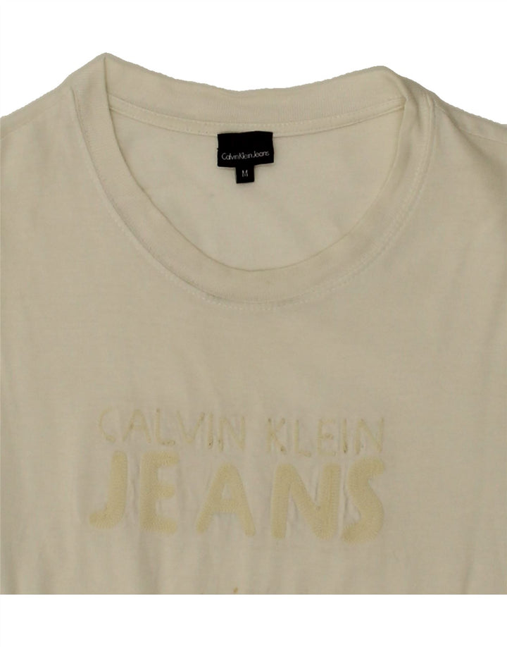 CALVIN KLEIN JEANS Mens Graphic T-Shirt Top Medium White Cotton Vintage Calvin Klein Jeans and Second-Hand Calvin Klein Jeans from Messina Hembry 