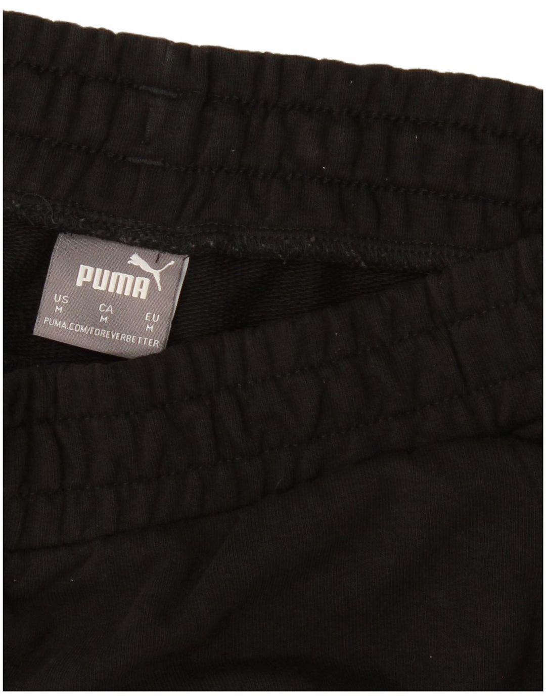 PUMA Pantalones de chándal con estampado gráfico Joggers Medium Black para hombre