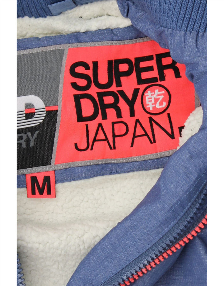 SUPERDRY Chaqueta cortavientos con capucha y gráfico para mujer UK 44 Azul medio