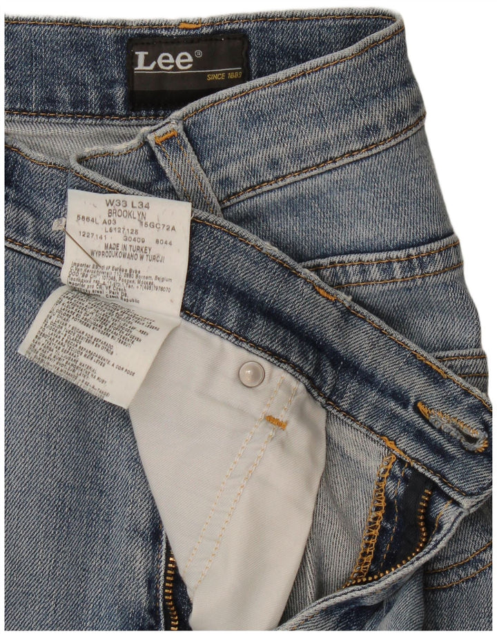 Vaqueros rectos desgastados Brooklyn para hombre Lee W33 L34 Algodón azul