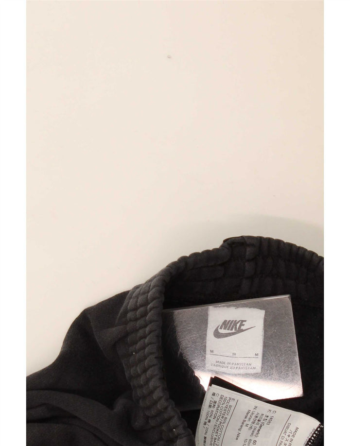 Nike Pantalones de chándal con gráfico para niños, 10-11 años, mediano, negro