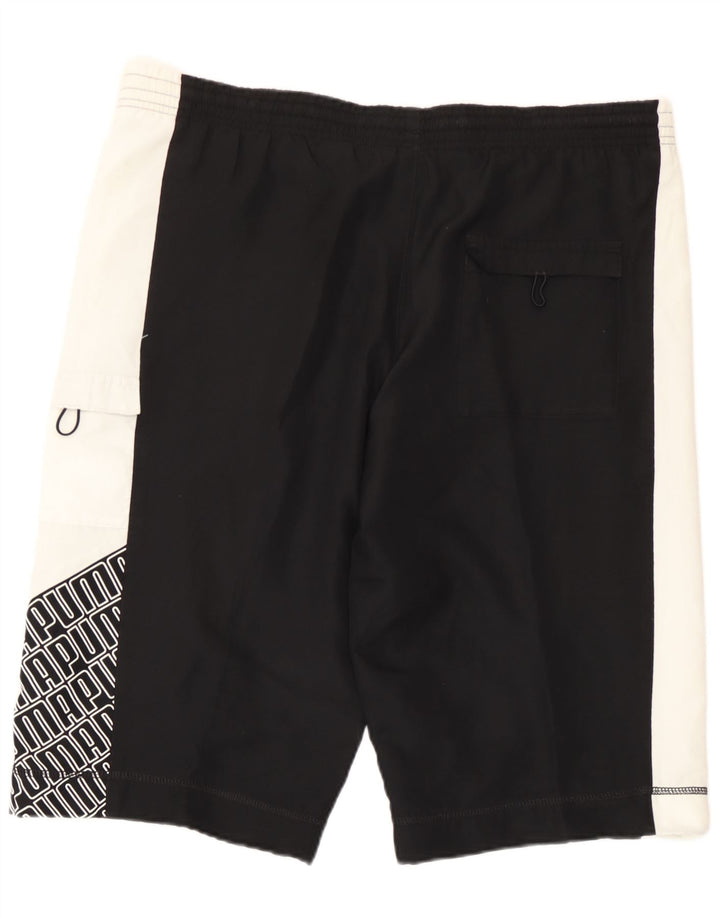 Puma Pantalones cortos deportivos con estampado gráfico en color negro mediano para hombre