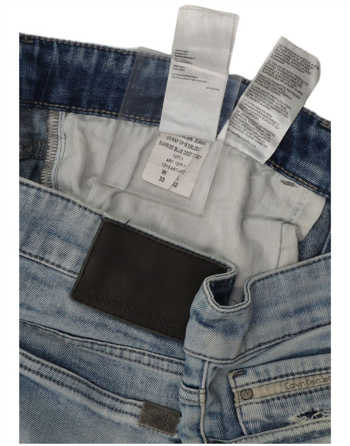 CALVIN KLEIN Vaqueros pitillo desgastados para hombre 33 L32 Algodón azul