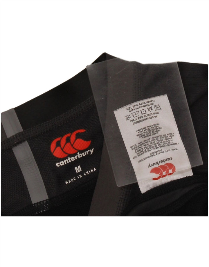 Canterbury - Camiseta gráfica para hombre, parte superior mediana, color negro, poliéster