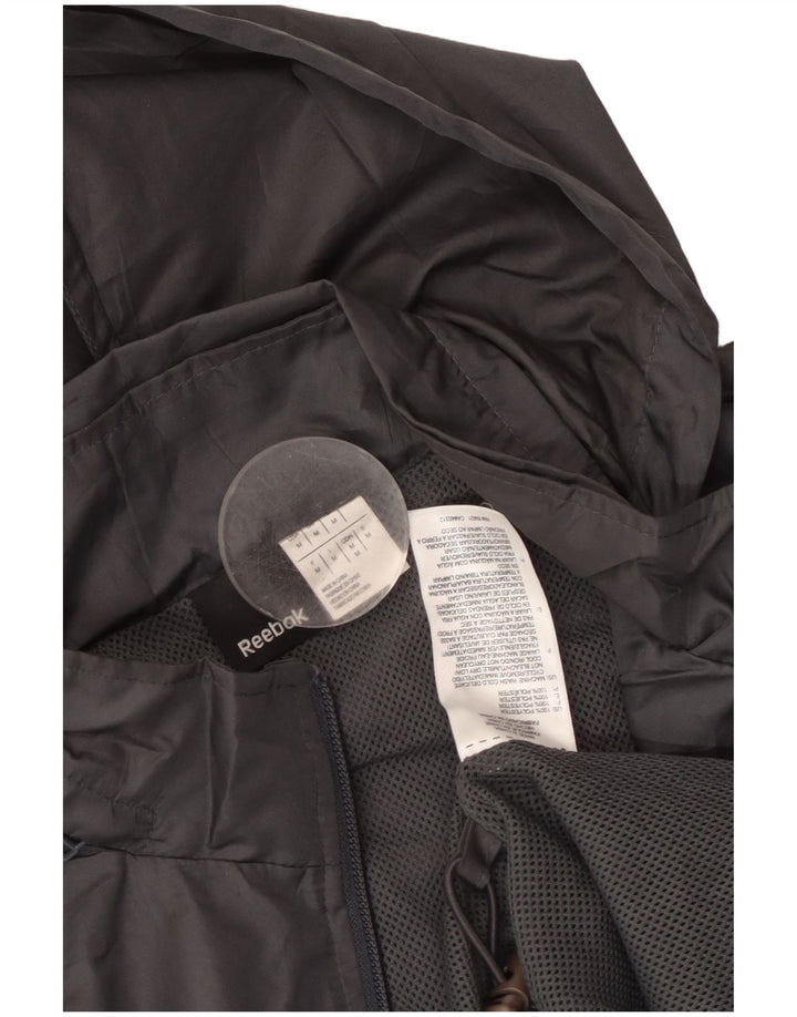 REEBOK Chaqueta impermeable con capucha para hombre ES 38 Gris medio Poliéster con bloques de color