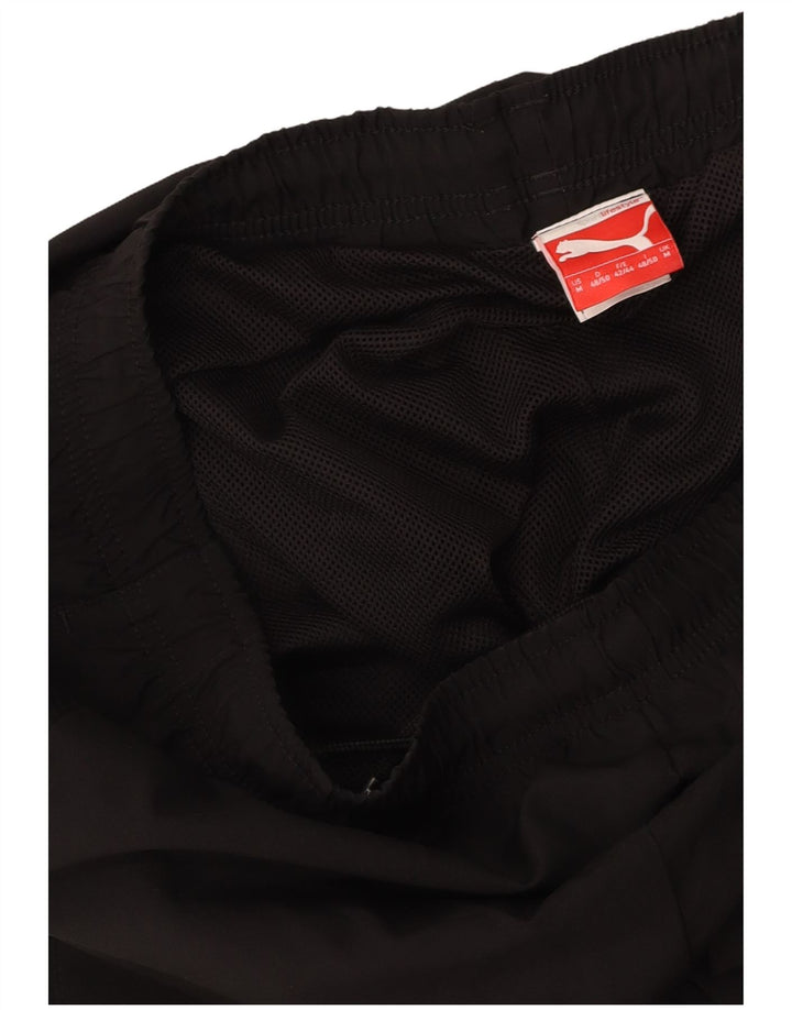 PUMA Pantalones de chándal con estampado gráfico Joggers Medium Black para hombre
