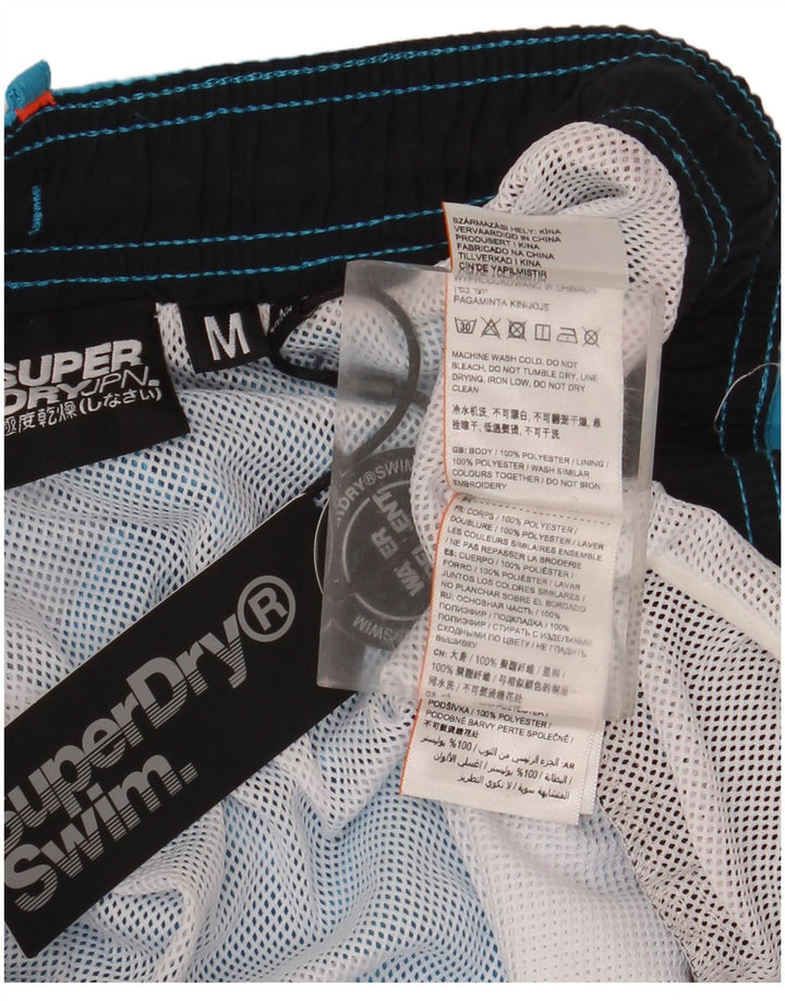 Superdry Bañador con estampado gráfico de poliéster color block en azul medio