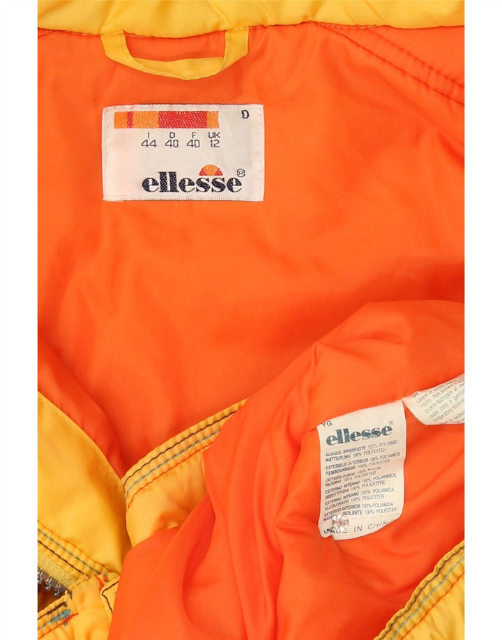 Chaqueta cortavientos con capucha de gran tamaño para mujer Ellesse UK 12 Medium Yellow