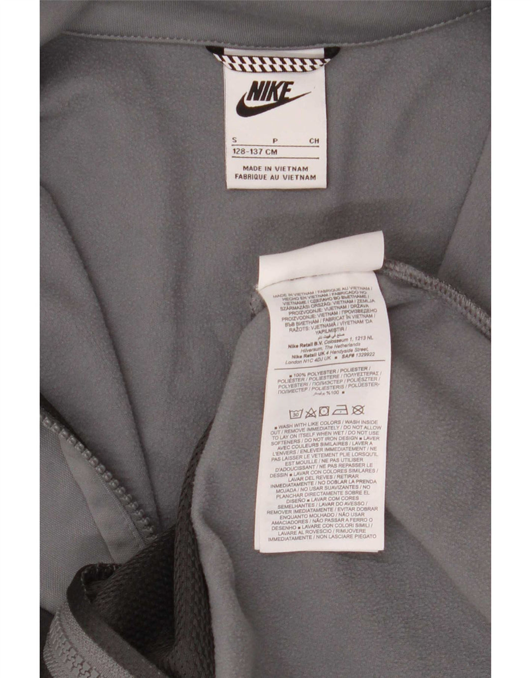 Nike - Chaqueta de chándal gráfica para niños de 8 a 9 años, color gris pequeño