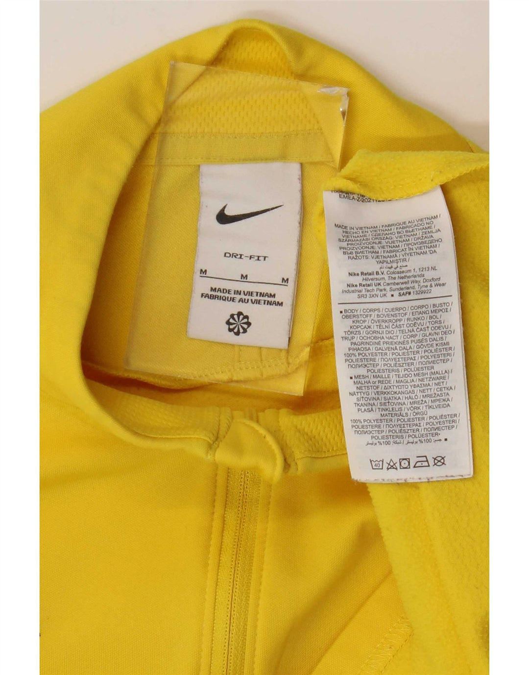 Camiseta de chándal Nike Dri Fit con cremallera y cuello en bloques de color amarillo medio para hombre