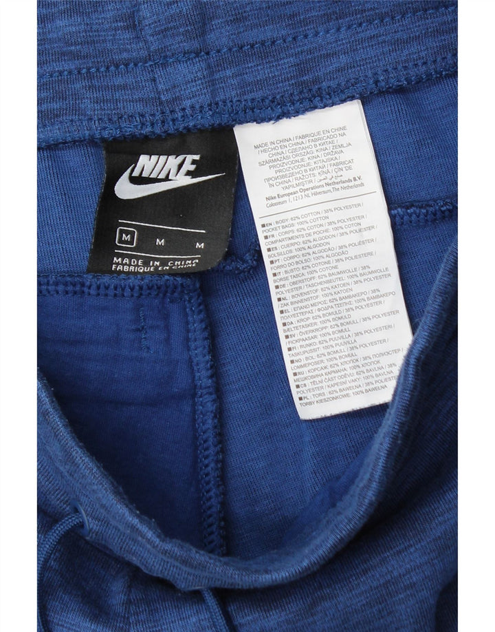 NIKE Hombre Pantalones de chándal Joggers de algodón moteado en azul medio