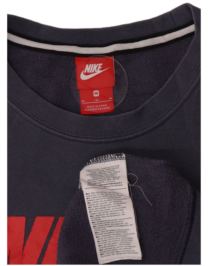 Nike Hombre Sudadera con gráfico tipo jersey de algodón color block en azul medio