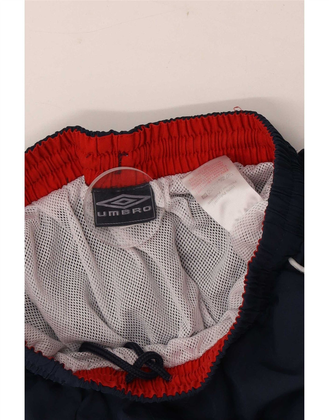 Pantalones cortos deportivos con gráficos Umbro para hombre Poliéster azul marino mediano