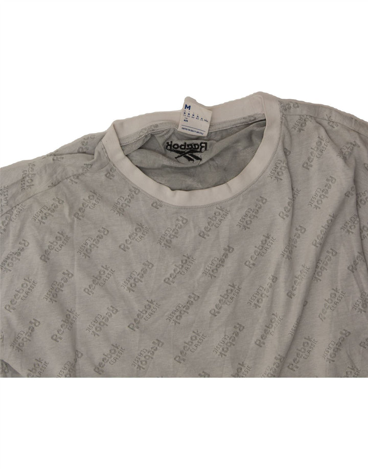 REEBOK Womens Oversized Crop Graphic T-Shirt Top UK 12/14 Medium Grey Vintage Reebok and Second-Hand Reebok from Messina Hembry 