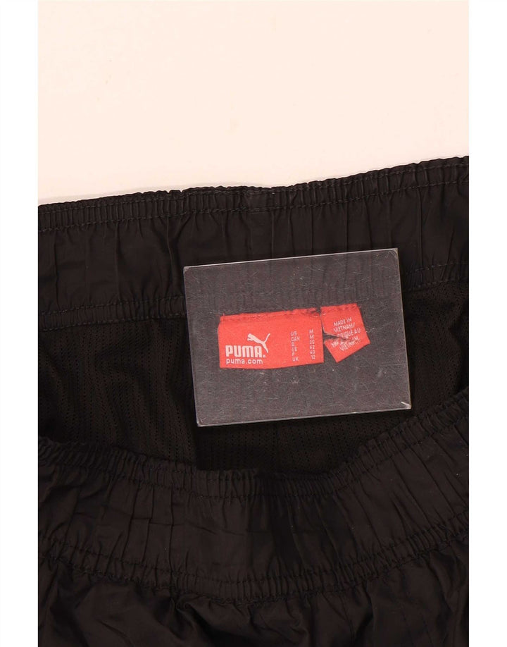Puma - Pantalones impermeables para mujer, talla 40, talla M, color negro