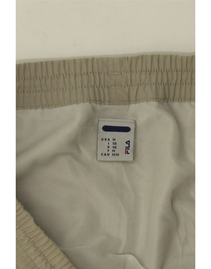 Fila Shorts deportivos gráficos con bloques de color verde medio para hombre