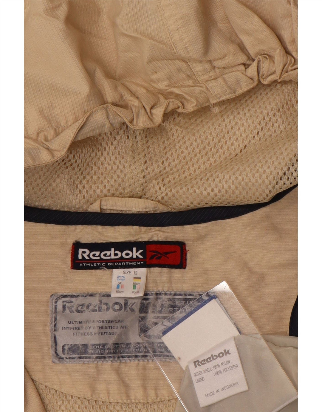 Reebok Chaqueta impermeable con capucha para mujer, talla 40, color beige medio