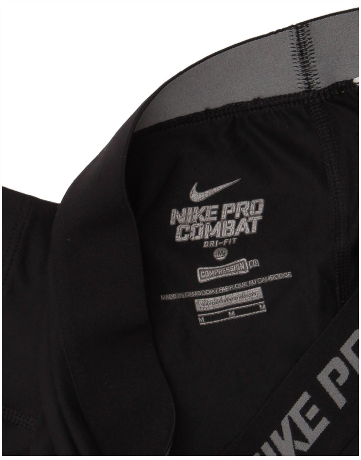 Nike - Leggings capri Dri Fit para mujer, talla M, color negro