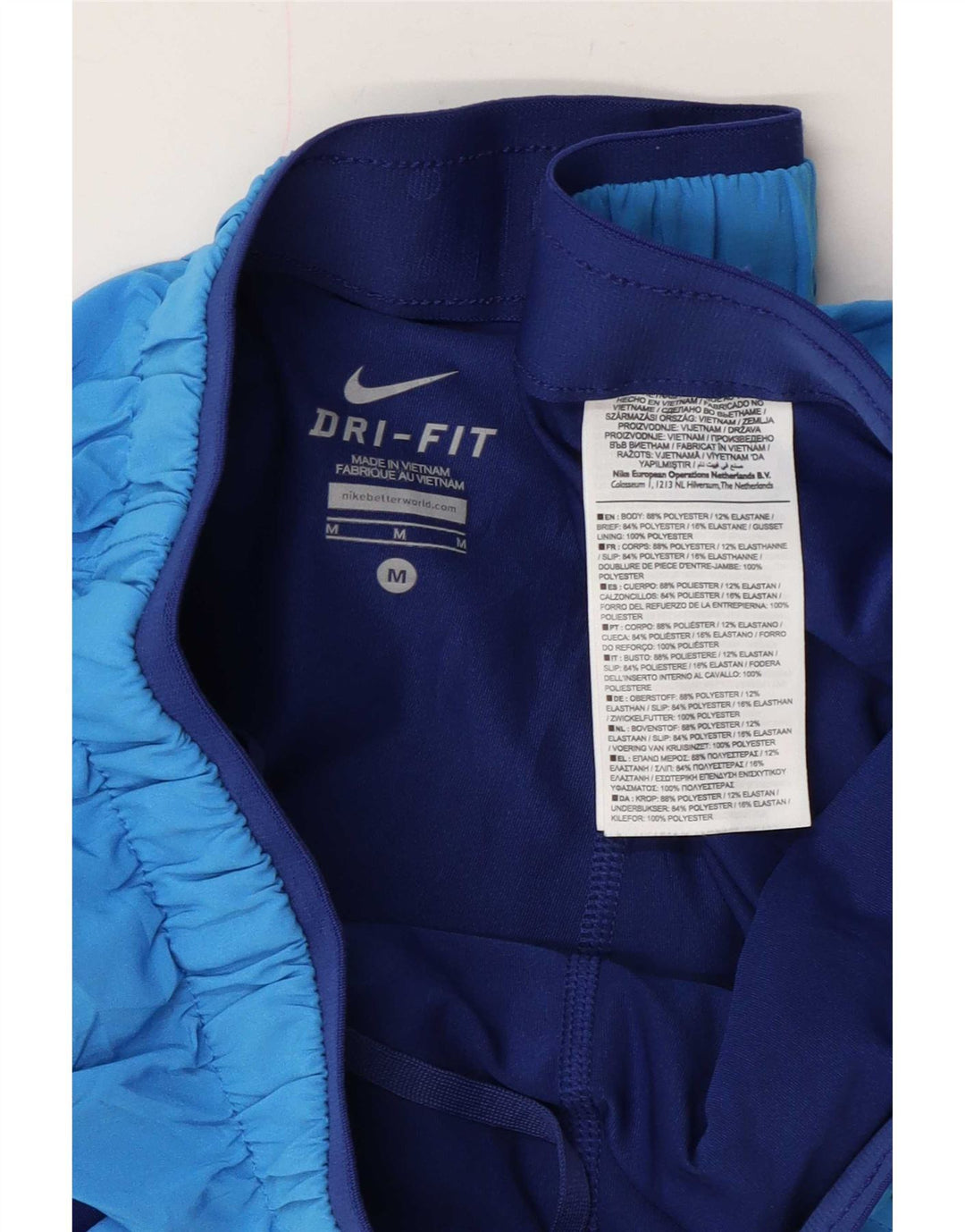 Nike - Pantalones cortos deportivos Dri Fit para mujer, talla 40, poliéster azul medio