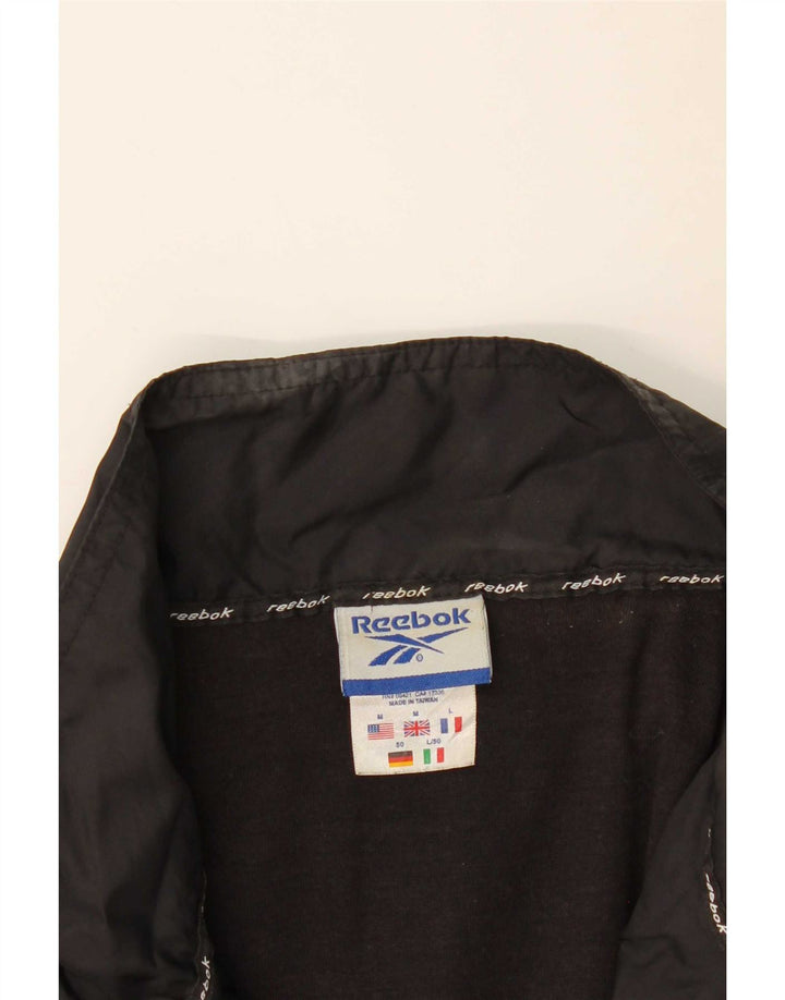 Reebok Chaqueta de chándal holgada para hombre con bloques de color negro mediano