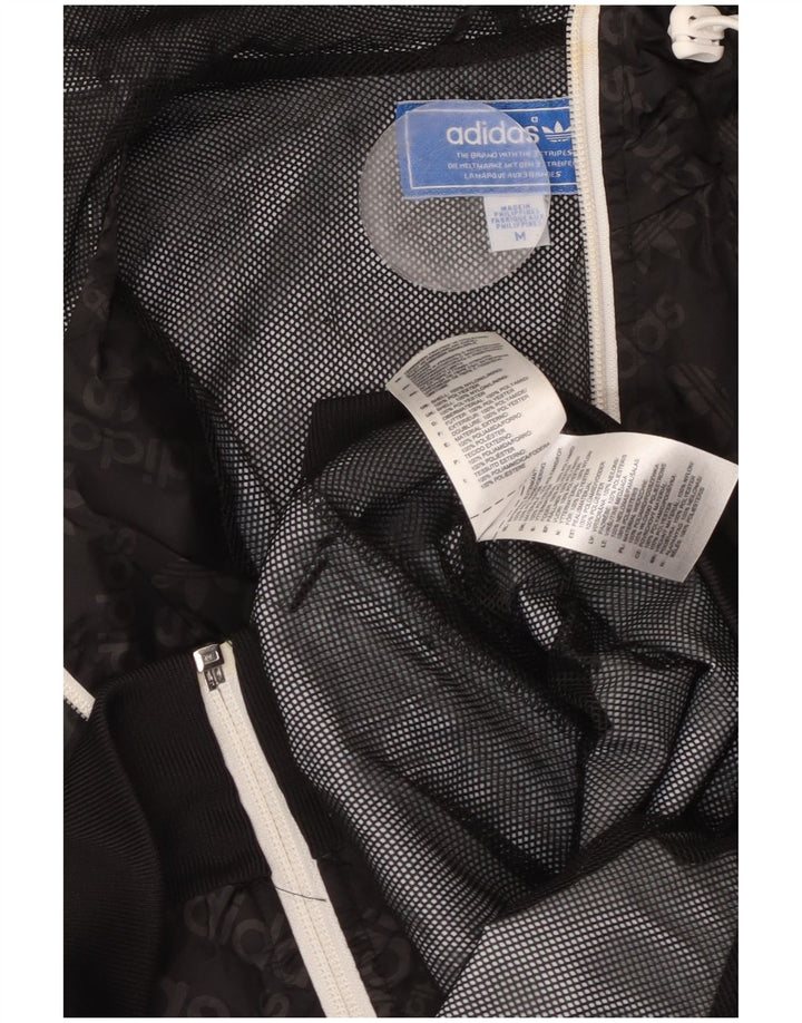 ADIDAS Chaqueta impermeable con capucha gráfica para hombre UK 38 Mediana Poliamida negra