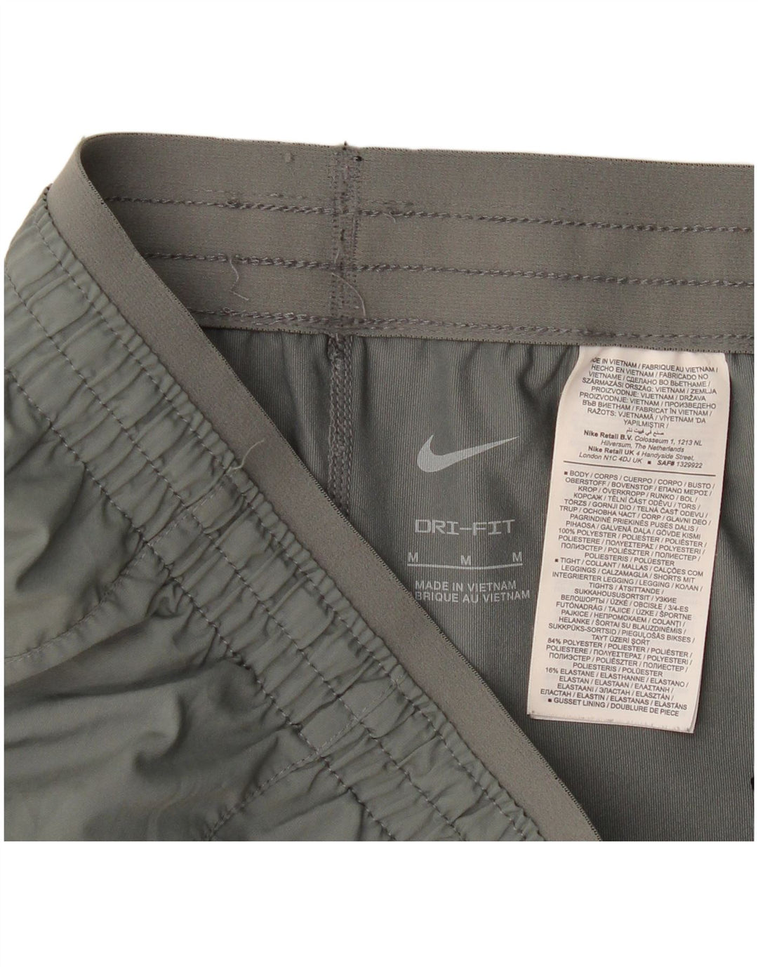 Nike - Pantalones cortos deportivos Dri Fit para mujer, talla 40, poliéster gris medio