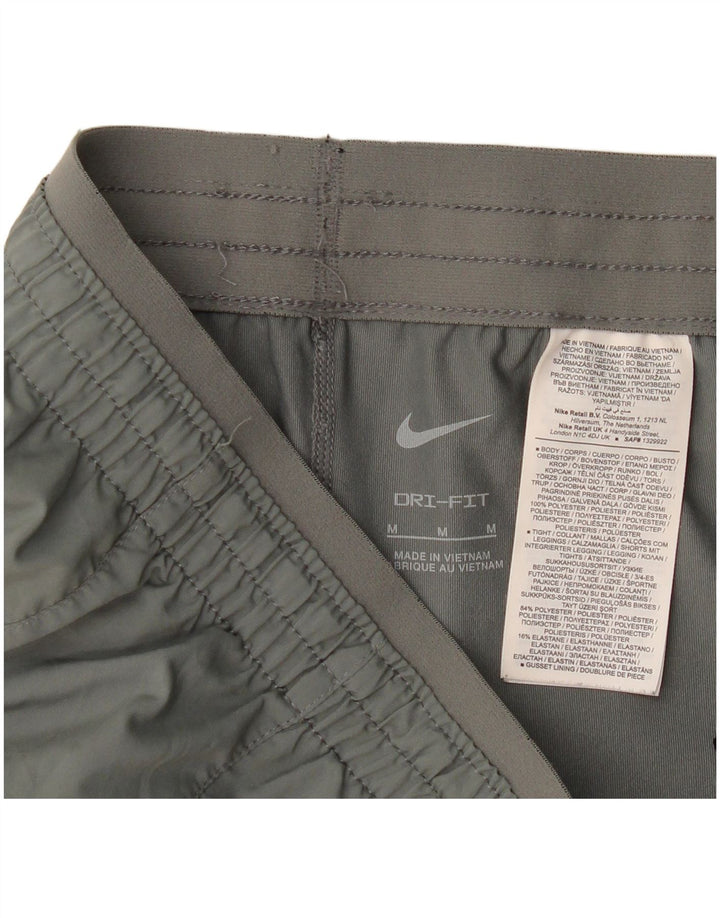 Nike - Pantalones cortos deportivos Dri Fit para mujer, talla 40, poliéster gris medio