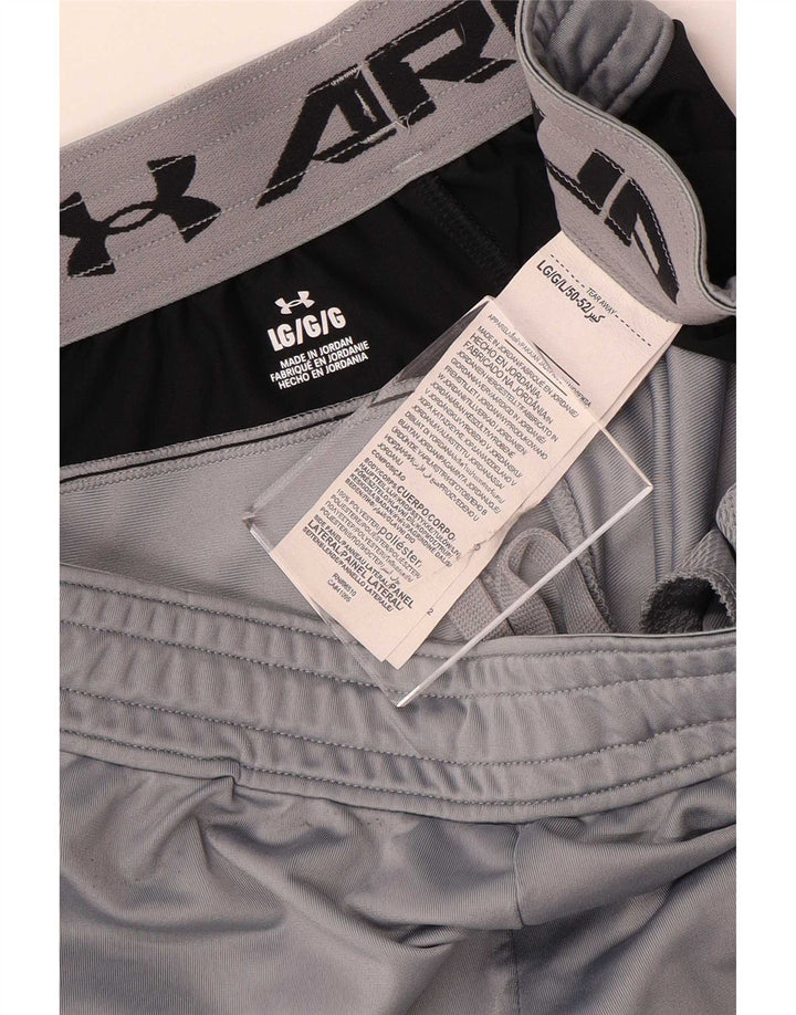 Under Armour Hombre Pantalones cortos deportivos con estampado de poliéster en bloques de color gris grande