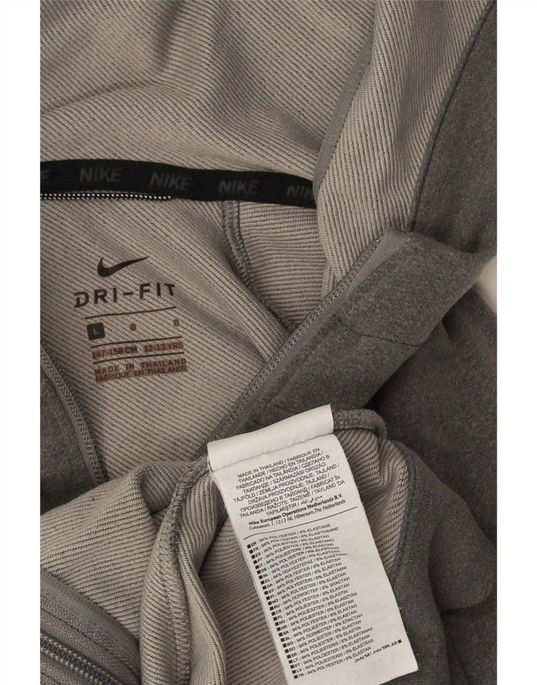 Nike - Sudadera con capucha para mujer Dri Fit con cremallera, talla 40, poliéster gris grande