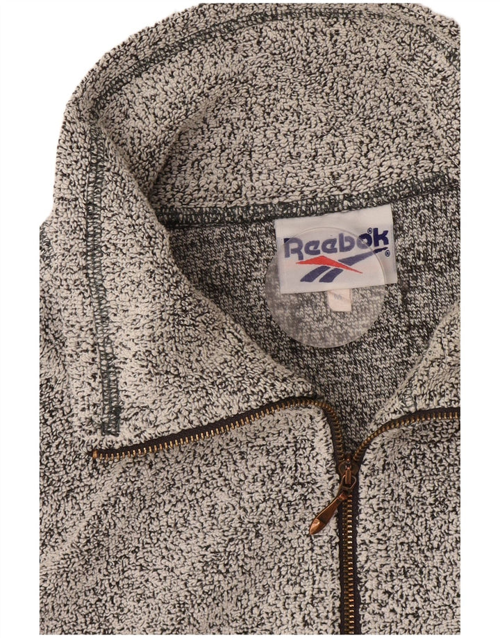 Reebok Top con cuello con cremallera y manga larga para hombre, color gris medio moteado