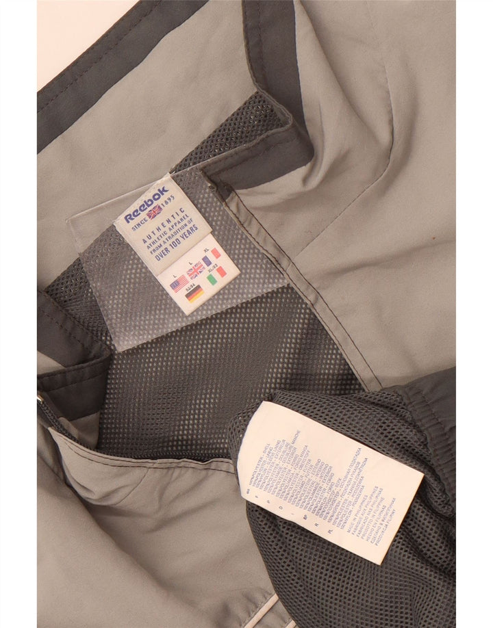 Reebok - Chaqueta de chándal con gráfico para hombre, poliéster color block, color gris grande