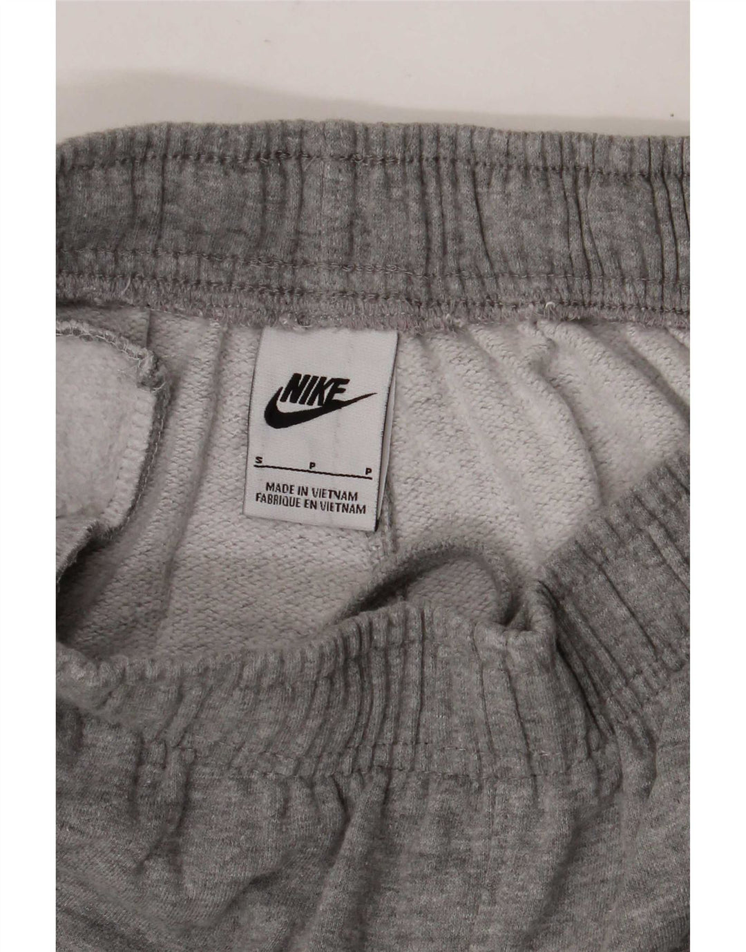 Nike - Pantalones de chándal para mujer, talla 8, color gris