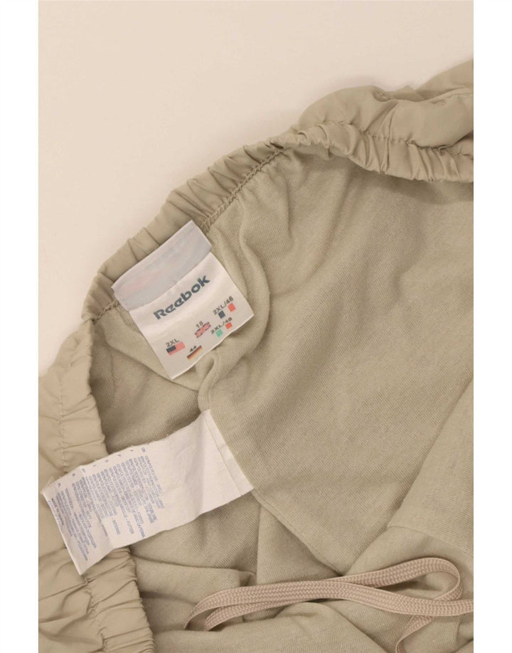 Reebok Pantalones de Chándal para Mujer ES 40 XL Beige Poliéster
