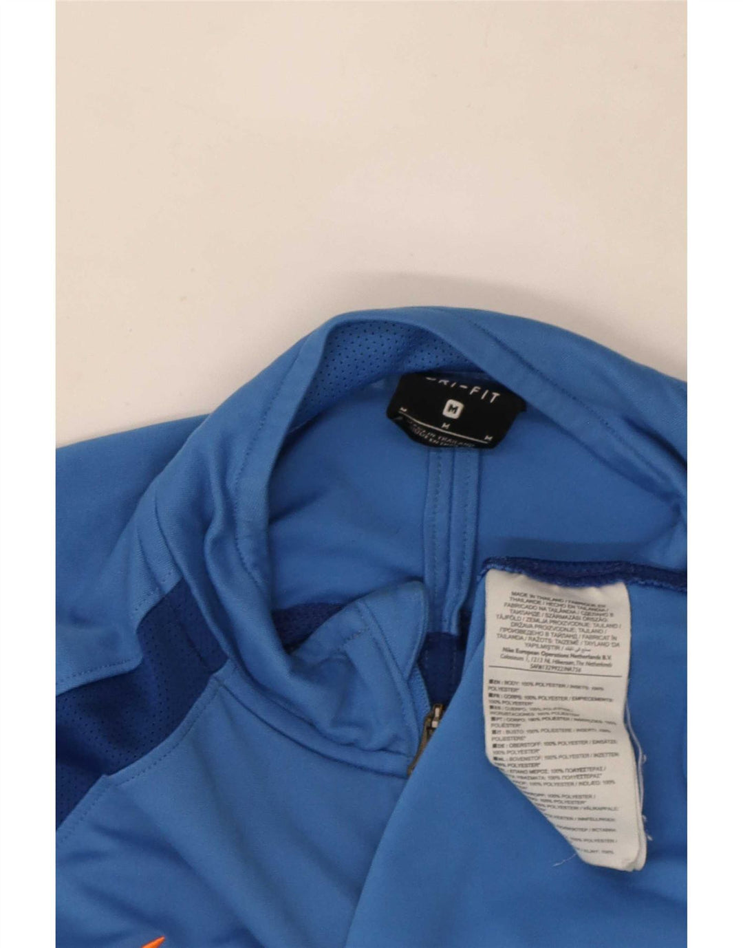 Camiseta de chándal Nike Dri Fit con cremallera y cuello en bloques de color azul medio para hombre